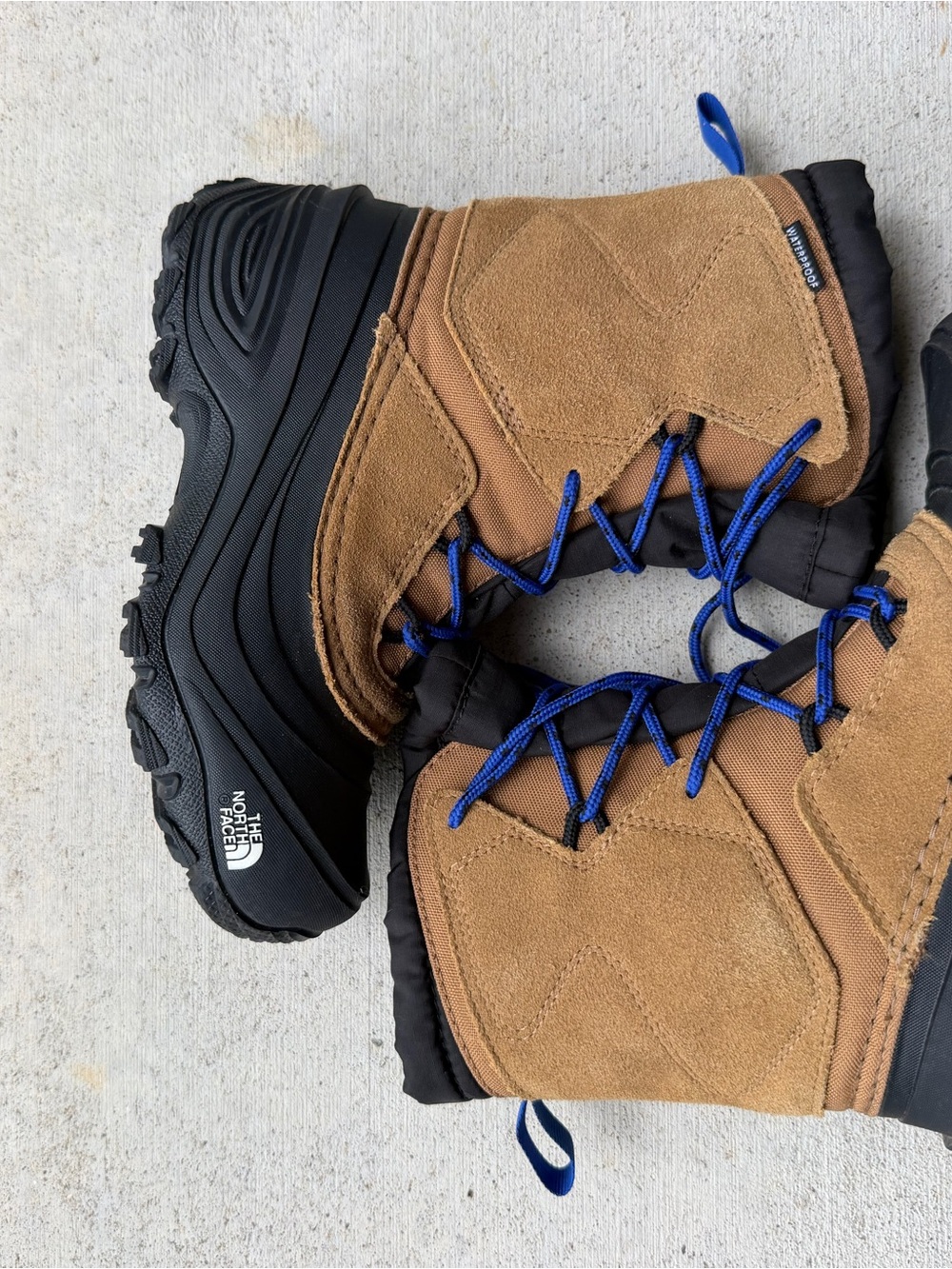 The North Face Brown Suede Winter Boots with Blue Laces